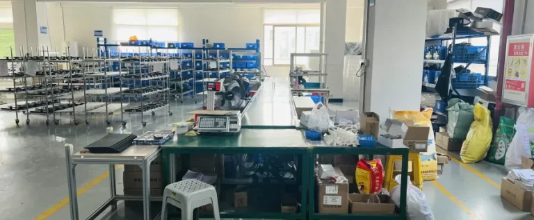Production workbench and materials area at the Zhongshan smart-lock factory